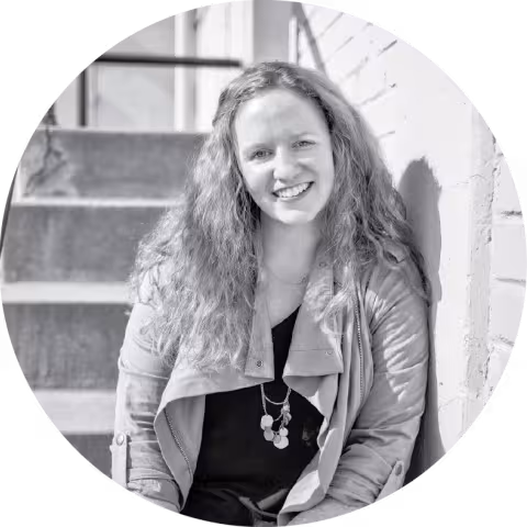 Image of Carol Quinn sitting on some stairs